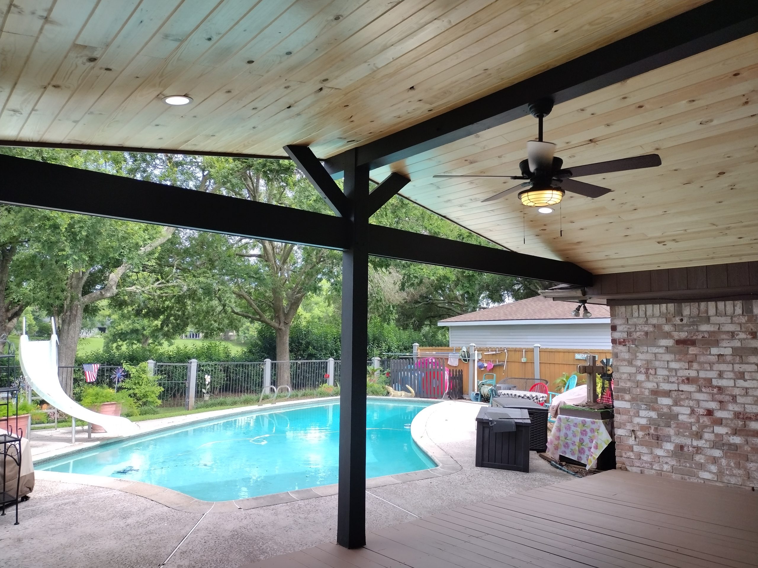 view of pool from patio awning