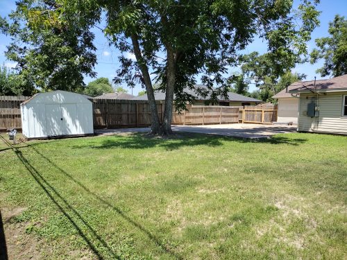 backyard view of house & toolshed