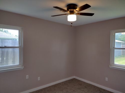 bedroom with 2 windows